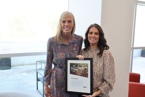 Two JTS leaders hold award.
